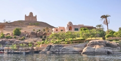 Nile River bank near Aswan, Aga Khan's Mausoleum on hill