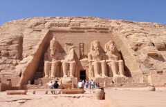 Temple of Ramesses II at Abu Simbel - smaller figures of his wife Nefetari and children can be seen at his feet.
